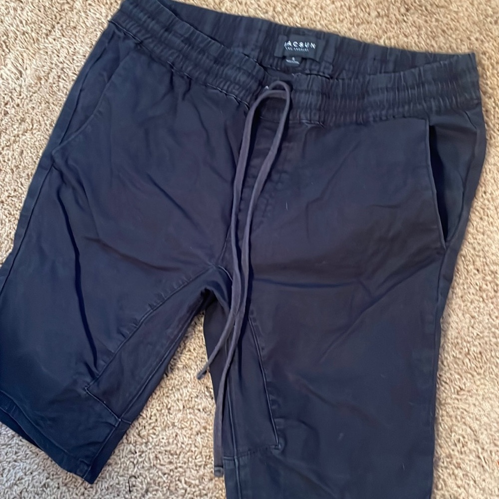 Men’s black PacSun shorts.